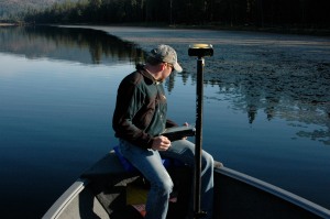 Aquatechnex biologist mapping invasive aquatic plant bed in North Idaho Lake